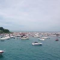 A flotilla of recreational boaters take part in an unsanctioned marine event on Lake Erie during the 2014 Operation Dry Water three-day weekend. The U.S. Coast Guard partners with other maritime law enforcement agencies during this annual campaign to reduce the number of alcohol- and drug-related accidents and fatalities while fostering a visible on-water deterrent. (USCG photo by Capt. Scott Anderson)