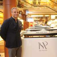 from the left, Giuseppe Palumbo, CEO of Palumbo Superyachts and Francesco Carbone, General Manager of Palumbo Superyachts by side ISA Classic 65 mockup at Louis Vuitton boutique (Photo: ISA Yachts) 