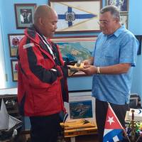 Victor Mooney with Comodoro, Jose Escrich at Club Nautico International Hemingway de Cuba in Havana.