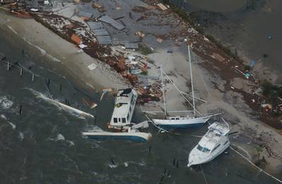 Boats are washed up on shore along the Florida coast during Hurricane Ivan in 2004. (U.S. Coast Guard photo by Stacey Pardini)