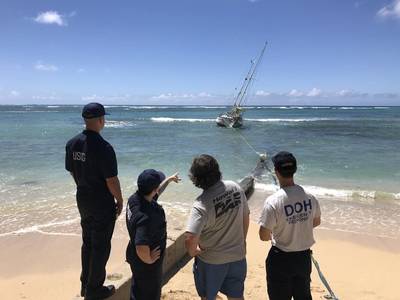 The Coast Guard, State of Hawaii, and salvors are working to remove the sailing vessel, Steady Beat, aground near Waikiki Reef Hotel, March 22, 2020. The owner’s insurance company has hired a salvage team to remove the 35-foot, double masted vessel. (U.S. Coast Guard photo by Russ Strathern) 