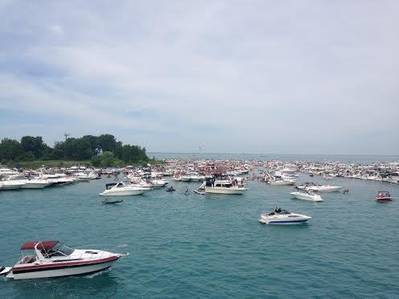 A flotilla of recreational boaters take part in an unsanctioned marine event on Lake Erie during the 2014 Operation Dry Water three-day weekend. The U.S. Coast Guard partners with other maritime law enforcement agencies during this annual campaign to reduce the number of alcohol- and drug-related accidents and fatalities while fostering a visible on-water deterrent. (USCG photo by Capt. Scott Anderson)