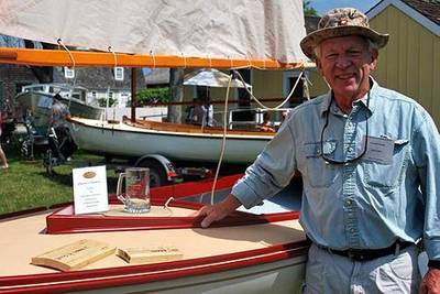 Richard Honan of Winthrop, MA, with his boat Proud Mary II, the 2014 winner of the “I Built it Myself” Award sponsored by Interlux® at the WoodenBoat Show.