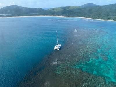 The yacht Obsession sits hard aground on a reef just off Flamenco Beach in Culebra, Puerto Rico. (Photo: U.S. Coast Guard)