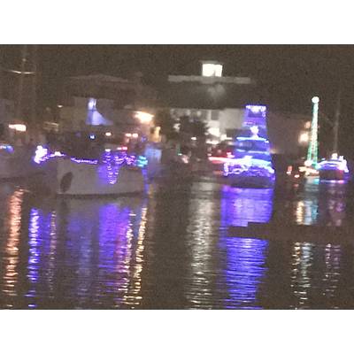 Boats line up for West End Boat Parade with Southern Yacht Club, background. New Orleans. Photo by Lisa Overing