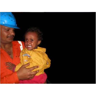 Crew members of the Synergy Managed bulker “Jupiter Bay” help two infants to safety who were among 322 people rescued from small overcrowded boats early on Saturday morning. Part of the humanitarian operation that the Italian Navy reports has seen the rescue of some 5200 people trying to cross from North African to Europe since Thursday June 5th. All 322 individuals were disembarked safely at the Italian Port of Pozzallo, Sicily on Saturday evening (7th). 