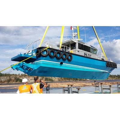 Pilot Boat Being Loaded with Ship Raven