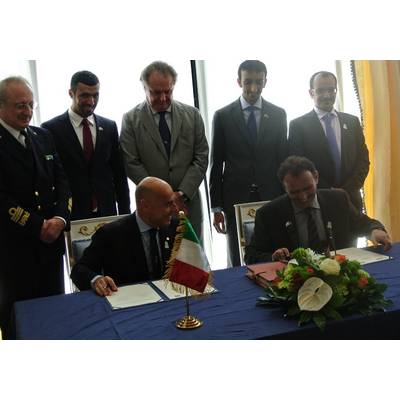 Ugo Salerno (seated, left) signing the agreement with Drydocks World