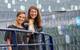 Jen Martin, Director of Field Staff & Expedition Development, and Ana Esteves, Director, Hotel Operations, toss the champagne bottle at the christening of National Geographic Endurance in Reykjavik, Iceland. 
Photo credit: Michael S. Nolan